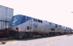 AMTK 46, 11, & 51 lead a train away from Pomona Station